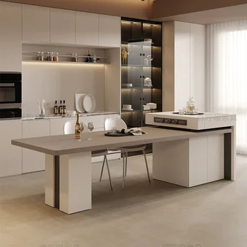 Модерна минималистичная кухня отворен план с плъзгащи островен плот и маса за хранене, изпълнен от сгъсти каменна панели integra